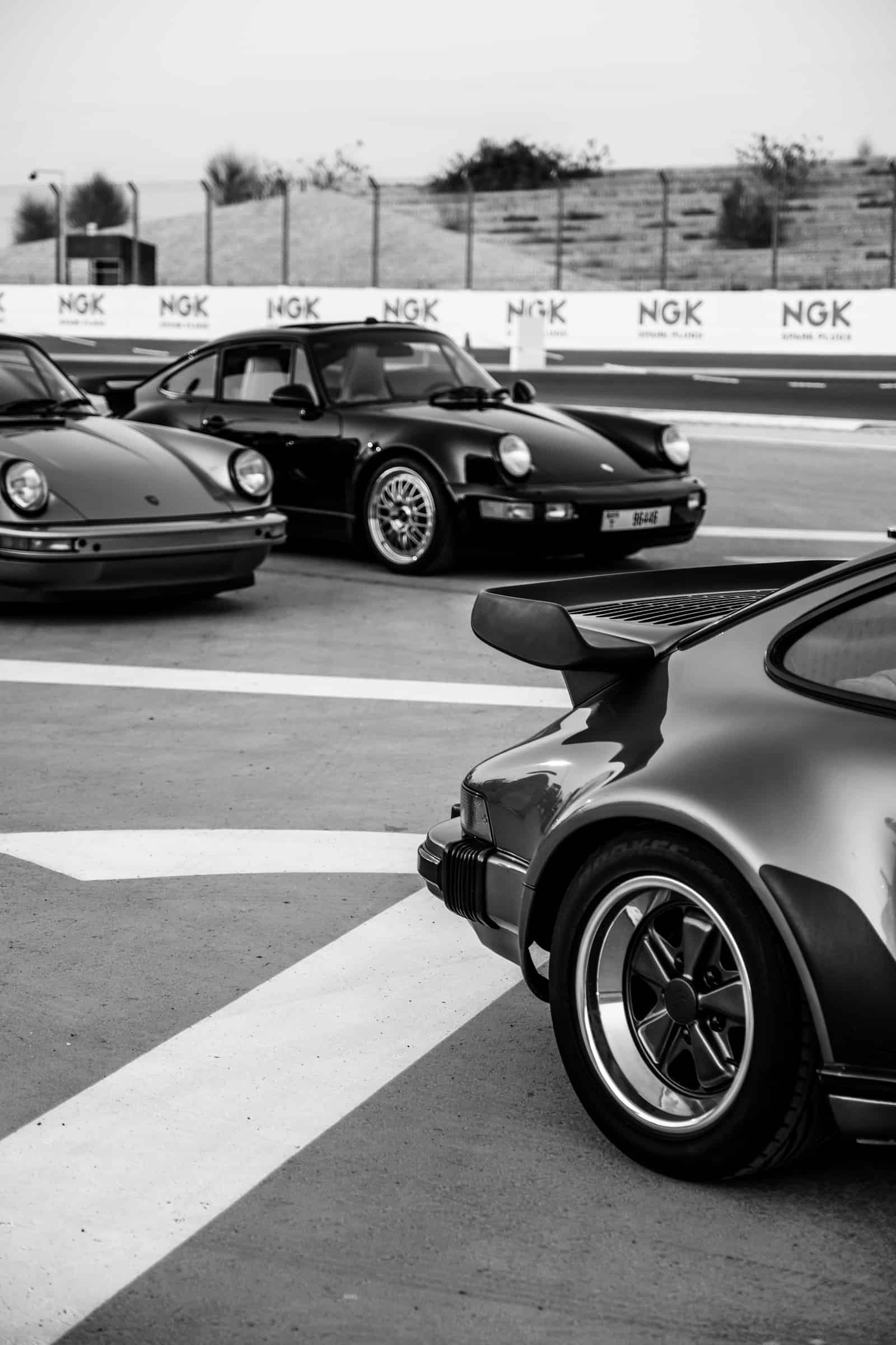 Three Porsches